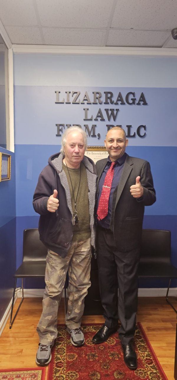 Juan Cifuentes with William R. Lizárraga at the firm's office